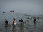 Migrants arrive on Tarajal beach after crossing the border between Spain and Morocco on July 31, 2026 in Ceuta, Spain. 