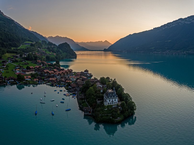 Overhead drone aerial view of The beautiful lake Brienz aand village of Iseltwald in Switzerland at sunset. Picture: Capchure