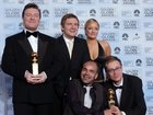 Ricky Gervais (left) has sent love to his The Office co-star Lucy Davis (back right) after her revelation that she has “incurable” breast cancer. 
