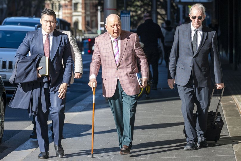 Veteran broadcaster Alan Jones arrived at Downing Centre Court fighting allegations he sexually touched and indecently assaulted six men.