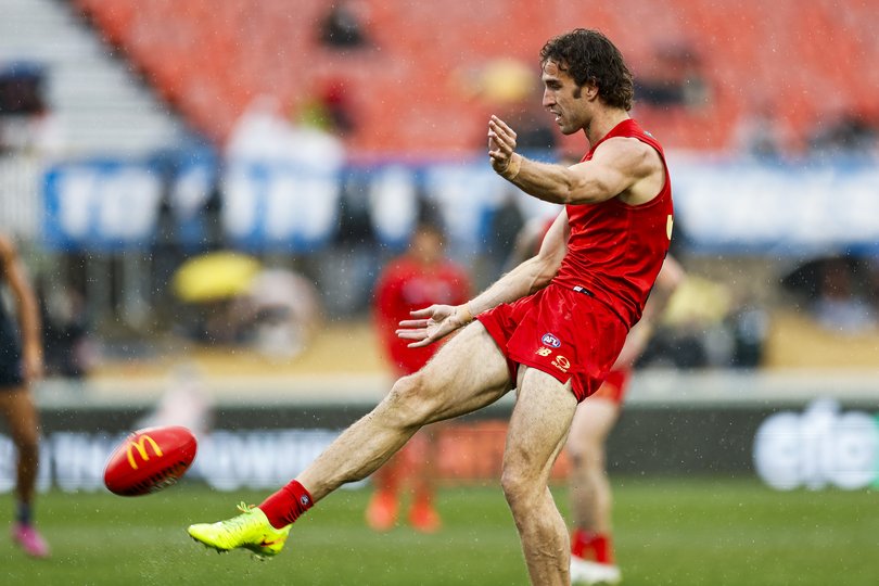Ben King of the Suns kicks a goal during the round 22.