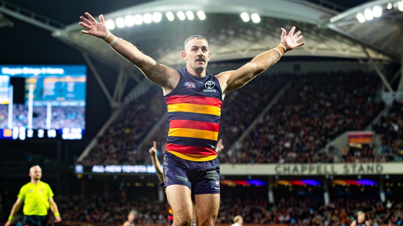 Taylor Walker of the Crows celebrates kicking his 700th goal.