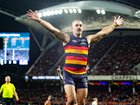 Taylor Walker of the Crows celebrates kicking his 700th goal.