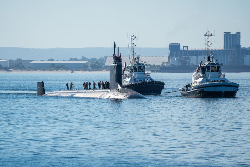 Virginia-class fast-attack submarine USS Minneso prepares to moor at HMAS Stirling, Western Australia.