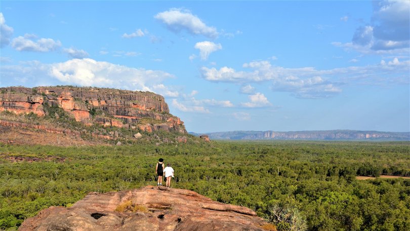 A day trip to one of Kakadu’s most celebrated lookouts has ended in tragedy, with a woman in her 30s dying at Ubirr as police work to determine what happened.