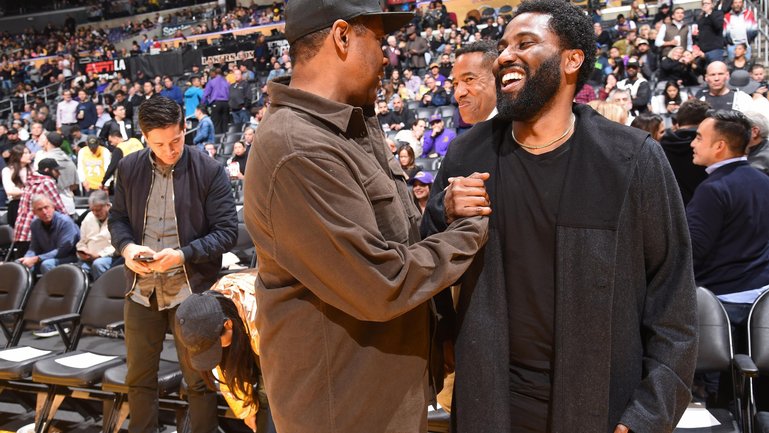 Denzel Washington and John David Washington at a Lakers game