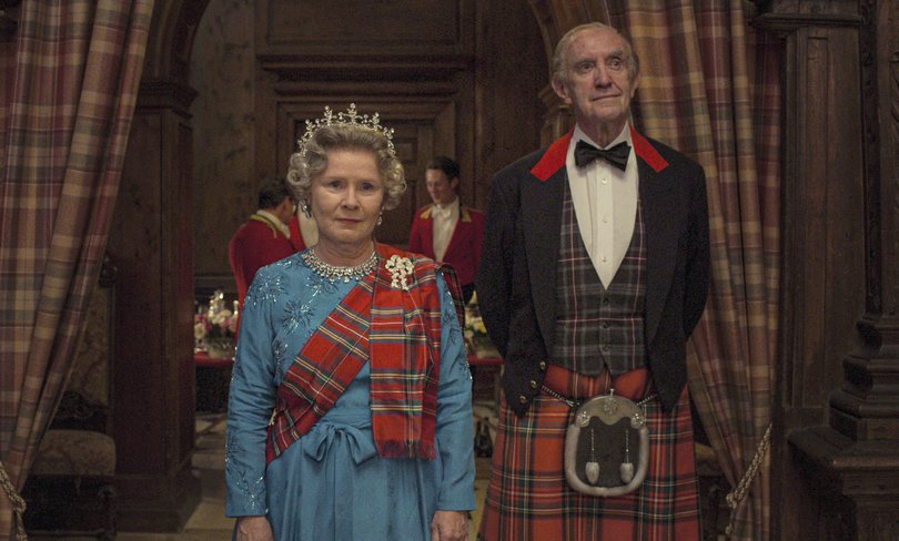 This image released by Netflix shows Imelda Staunton as Queen Elizabeth II, left, and Jonathan Pryce as Prince Phillip in a scene from "The Crown." (Netflix via AP)