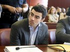 FILE — Luigi Mangione, charged in the murder of UnitedHealthcare chief executive Brian Thompson, confers with one of his attorneys at a pretrial hearing in State Supreme Court in Manhattan, Dec. 11, 2025. Mangione is expected to plead guilty to federal stalking charges on Aug. 14, 2026. A separate murder trial is set to begin next month. (Jefferson Siegel/The New York Times)