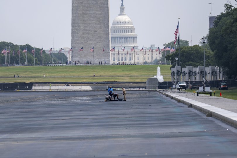 Workers inspect the Lincoln Memorial Reflecting Pool in Washington, July 20, 2026. 