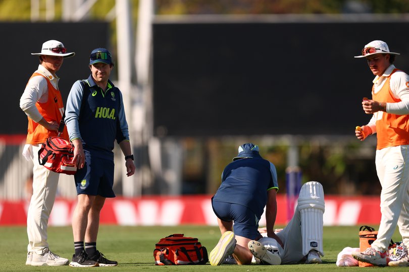 Steve Smith of Australia receives some treatment at the drinks break.