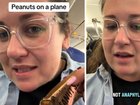 Madi said she was enjoying a Whittaker’s Peanut Slab, a popular Kiwi treat, while walking along the airbridge when a female passenger began making comments about the snack.