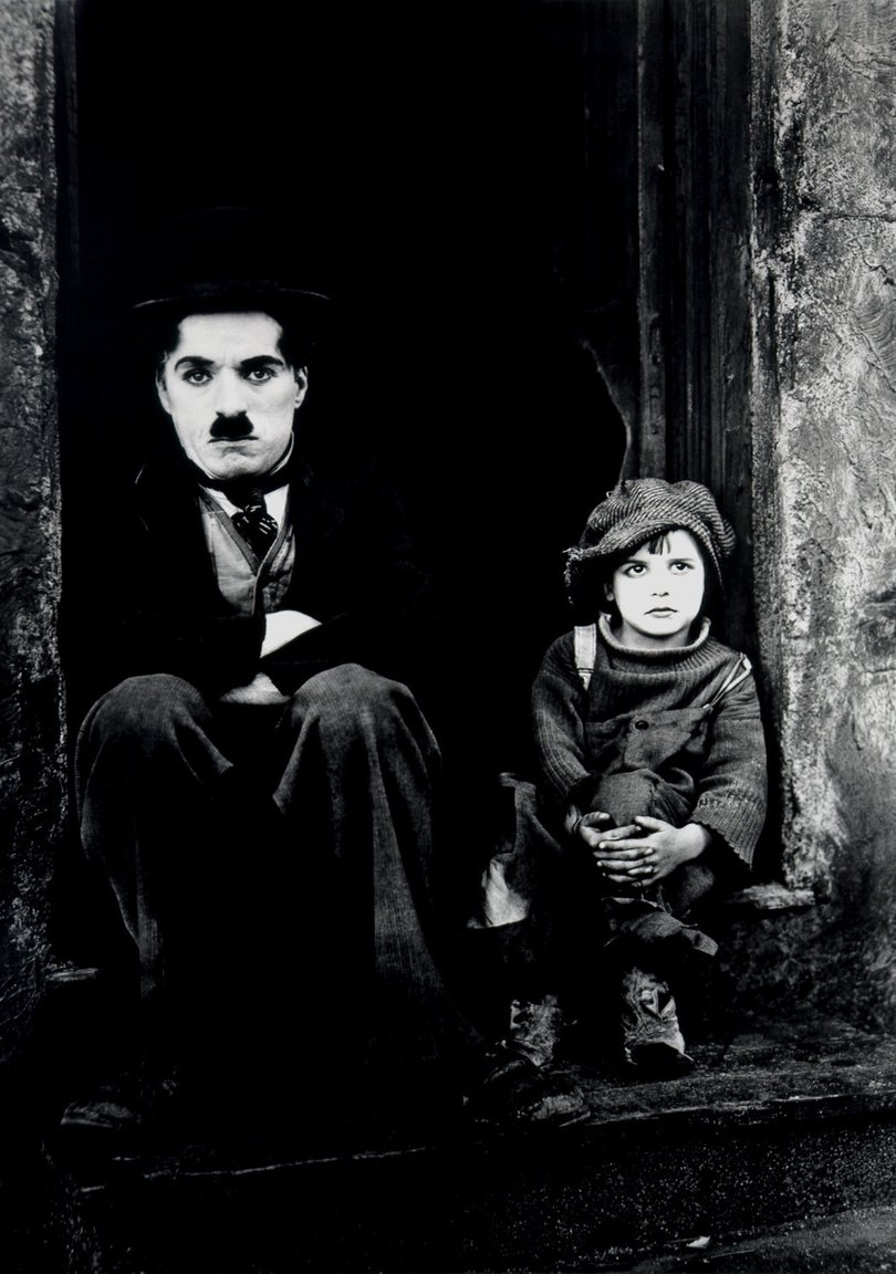 Charlie Chaplin and Jackie Coogan in The Kid.