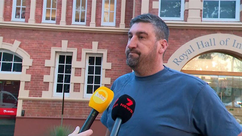 Sydney Swans coach Dean Cox cut a deflated figure as he faced questions at Swans HQ on Tuesday morning, with at least four of his players assisting police inquiries into a report of sexual assault. Picture: 7NEWS