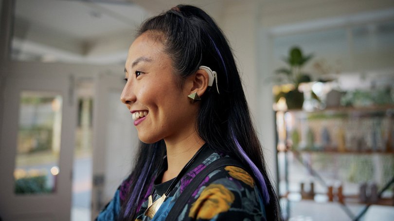Hearing implant pioneer Cochlear has relieved investors with a full-year result at the upper end of its revised guidance, saying adoption of its new high-tech product has been strong.