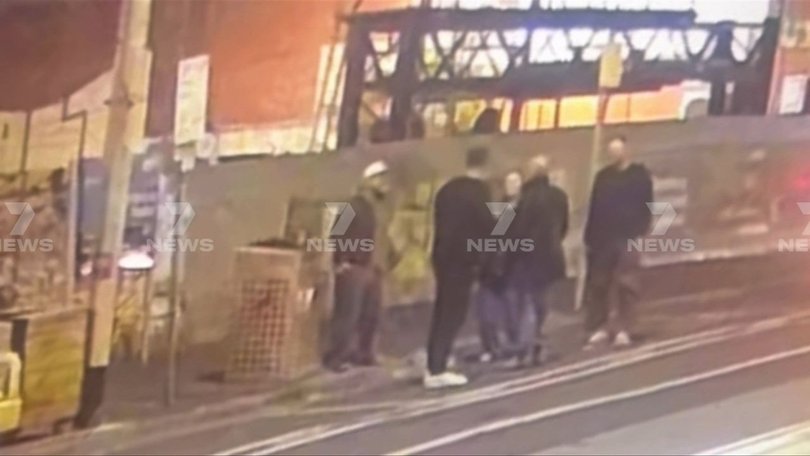 The coach was standing with fellow Swans staff near Harlow Bar, where there was a club function.