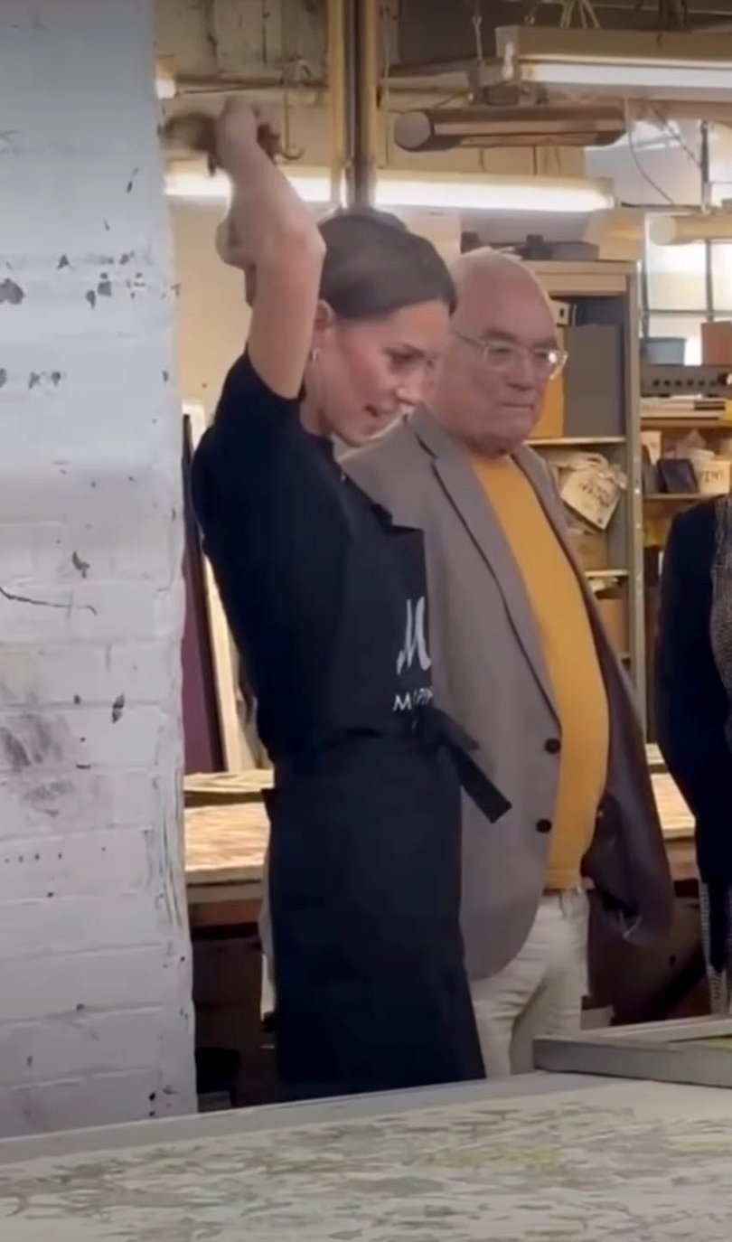 Princess Catherine ties her hair up while visiting Marina Mill in 2025.