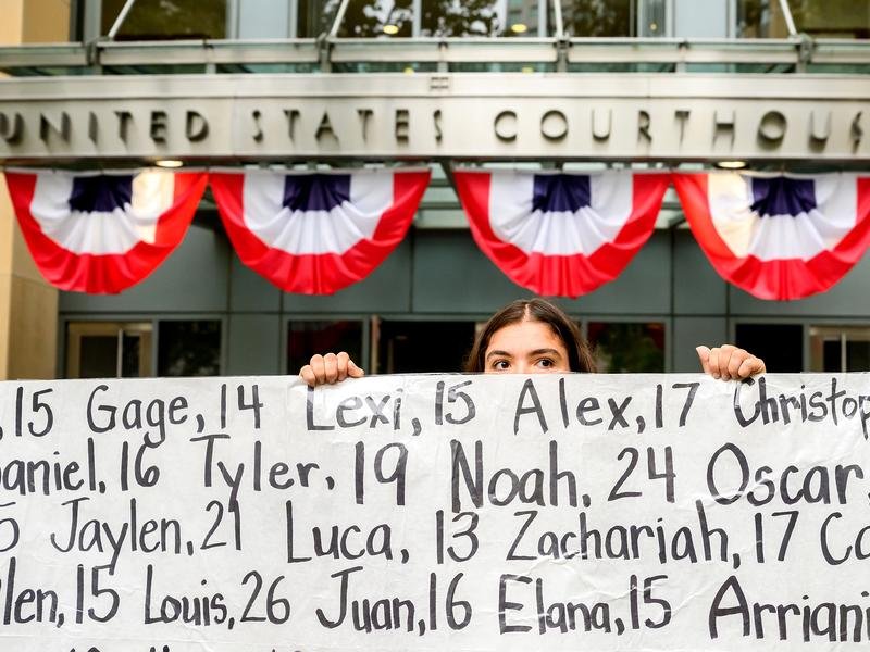 Protesters have held a banner naming children whose deaths were allegedly connected to social media. (AP PHOTO)