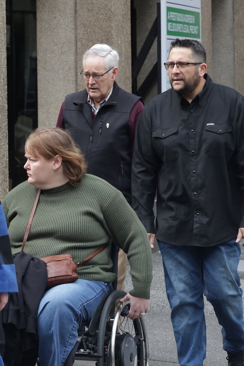 Poisoning survivor Ian Wilkinson arrives with family members at the Victorian Supreme Court of Appeal for the Erin Patterson case.