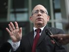 Israel’s Ambassador to Australia Hillel Newman holds outside Parliament House in Canberra on Thursday.