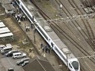 Four workers were killed while doing weed control on tracks at a Japanese train station. (AP PHOTO)