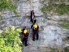 Two rescuers were lowered down to save Carl from the ledge.