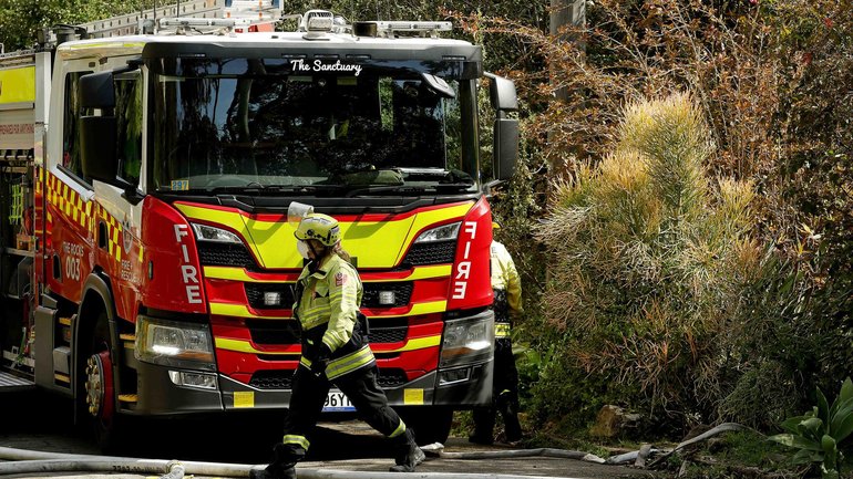 An 87-year-old woman and two five-year-old girls were inside the home when it was engulfed in flames. 