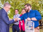 Prime Minister Anthony Albanese signs State Political reporter Dylan Caporn's arm at a press conference in Thornlie on Monday pledging WA's fair share of the GST deal. Kelsey Reid
