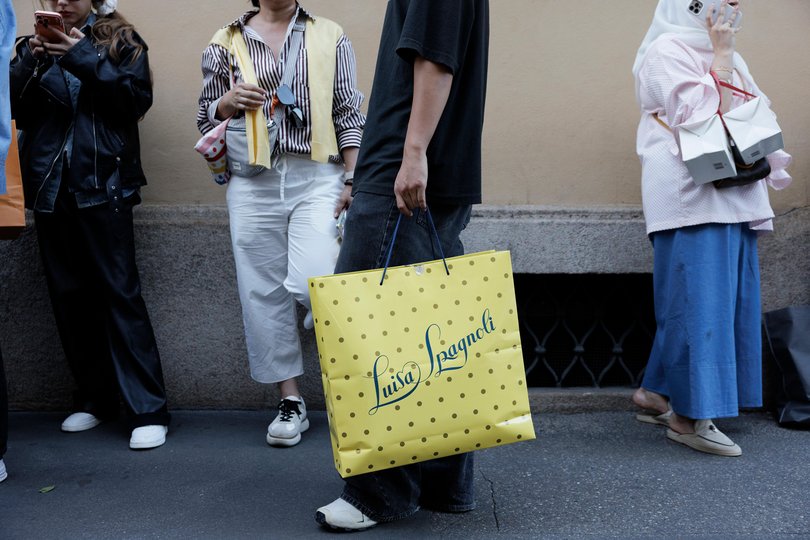 As millions of visitors flock to places like Milan, residents are rethinking what they share and who they share it with.