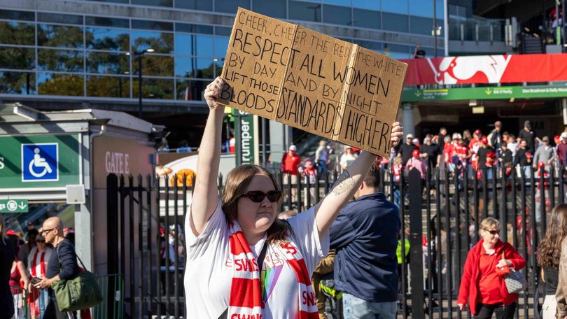 Swans fans made their feelings about the scandal known after leaving the SCG following the AFLW game. Picture: NewsWire / Nadir Kinani
