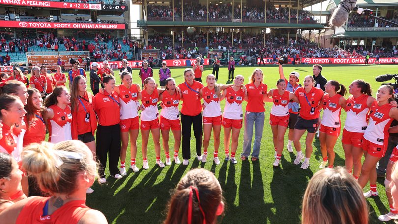 Swans players sing the song after their win.