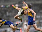 Nick Watson of the Hawks flies for a mark.