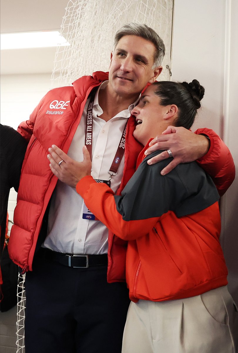 Swans CEO Matthew Pavlich embraces Lucy McEvoy, captain of the Swans AFLW team.