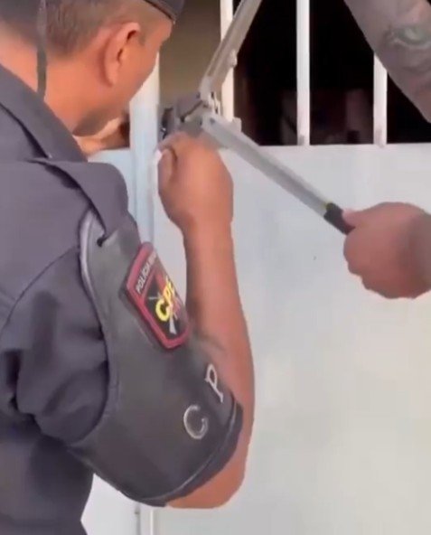 Police storm the home.