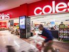 A shopper pushes a trolley outside a Coles supermarket in Sydney.