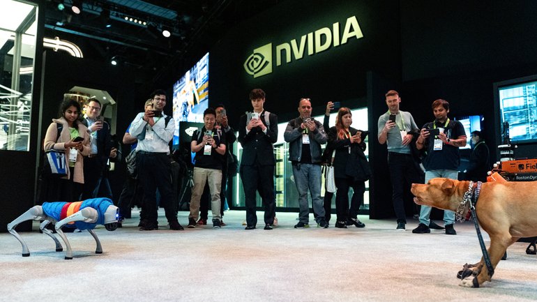A dog interacts with a robotic dog during the Nvidia GTC (GPU Technology Conference) in Washington, DC, in October 25.