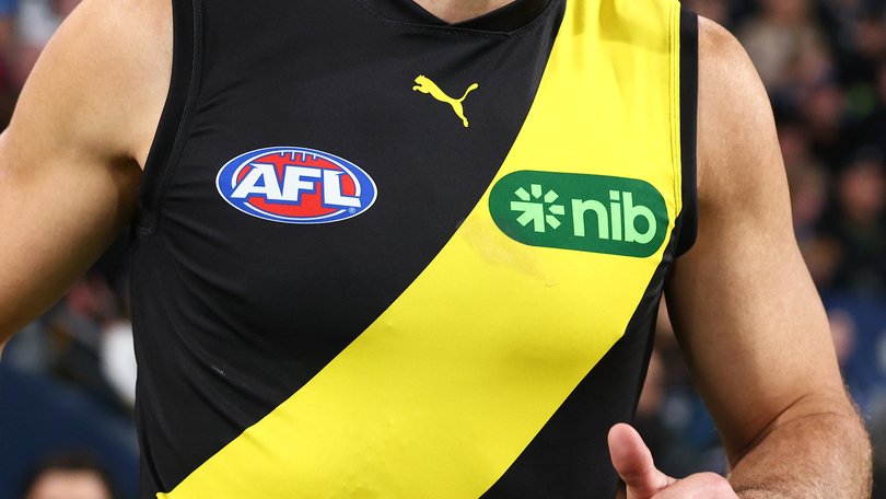Toby Nankervis of the Tigers leads the team out.