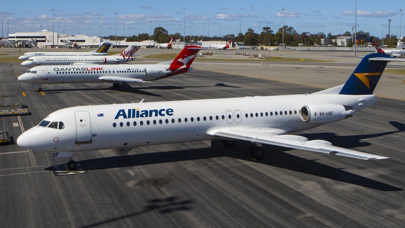 Alliance, Qantas, Virgin and Skippers Fokker 100s at Perth Airport.