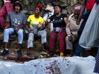  A body lies on the ground as people react following overnight violence in Kenscoff, a neighbourhood near Port-au-Prince, Haiti.
