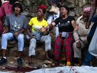 A body lies on the ground as people react following overnight violence in Kenscoff, a neighbourhood near Port-au-Prince, Haiti.