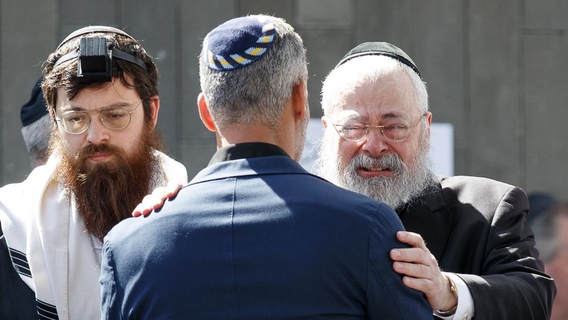 Rabbi Yehoram Ulman (right), at the funeral service for Rabbi Eli Schlanger, his son in law.