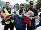 An elderly woman is rescued following the flash flooding in the Nuwakot district of Nepal.