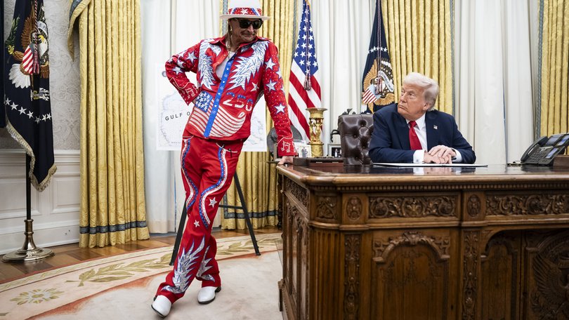 Musician Kid Rock appears alongside President Donald Trump in the Oval Office.