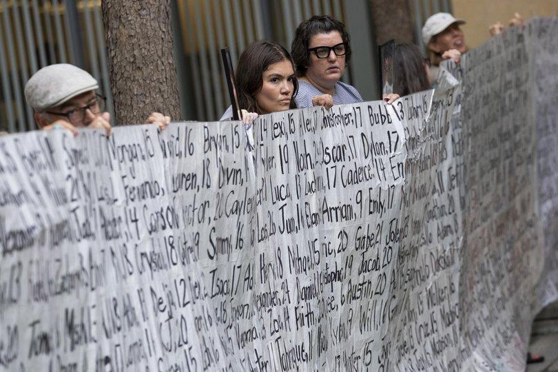 Family members and supporters hold a banner with the names of nearly 400 young people who allegedly died from the impacts of social media outside the Ronald V. Dellums Federal Building & United States Courthouse in Oakland, California, on August 18, 2026.