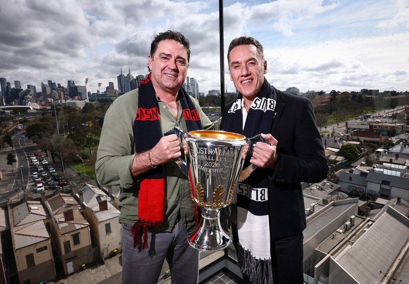 Garry Lyon - Demons great and Anthony Koutoufides - Blues great pose for a photo with the cup during the AFL Finals Launch.