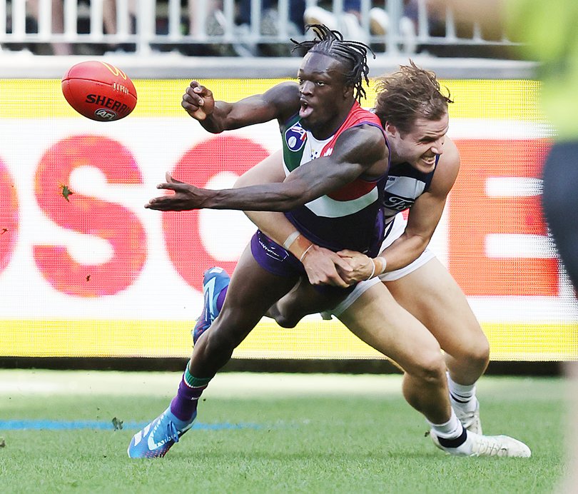 Sport. AFL. Fremantle Dockers v Geelong Cats art Optus Stadium in Perth. Docker Michael Frederick and Cat Jake Kolodjashnij.