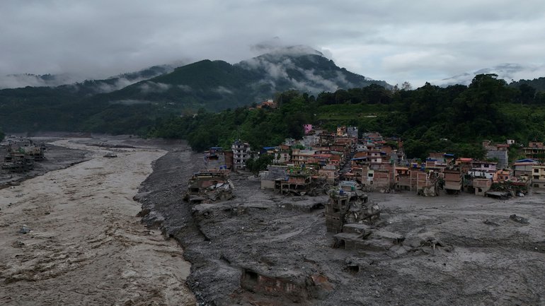 A drone view shows mud covering properties following a flash flood in Trishuli, Nuwakot district, Nepal.