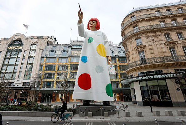 A huge sculpture in the likeness of Yayoi Kusama is erected between the headquarters of the Maison Louis Vuitton and the Samaritaine department store on March 06, 2023 in Paris, France.