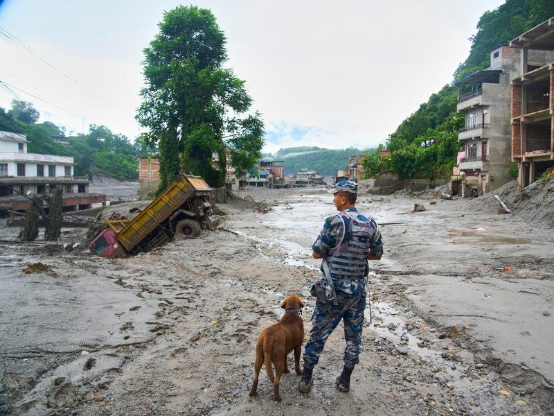 Rescue teams are searching for hundreds of missing people along the Nepal-China border. (AP PHOTO)