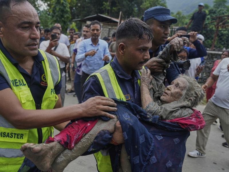Thousands of personnel are scrambling to find and ferry flood survivors to safety. (AP PHOTO)