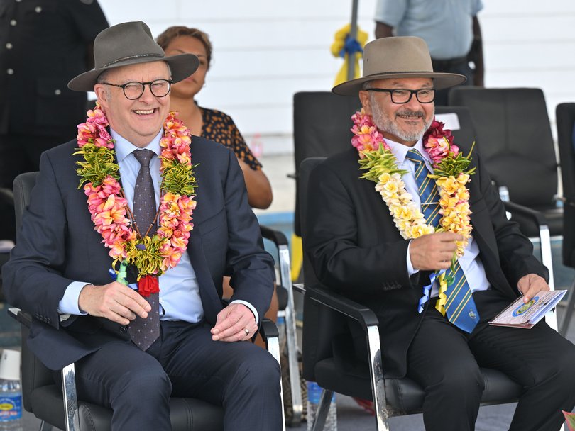 Anthony Albanese and Solomon Islands Prime Minister Matthew Wale receive garlands during Independence Day celebrations in Honiara.